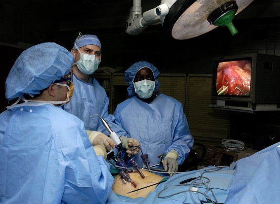 050131-F-1936B-008 Doctors Ronald Post (left) and John Smear (center) and Physician's Assistant Debra Blackshire perform laparoscopic stomach surgery at Langley Air Force Base, Va., on Jan. 31, 2005.  The surgery will involve the removal of the gall bladder to help alleviate acid reflux disease.  DoD photo by Staff Sgt. Samuel Bendet, U.S. Air Force.  (Released)
